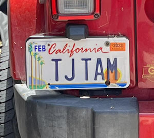 TJ Tam - red Jeep license plate